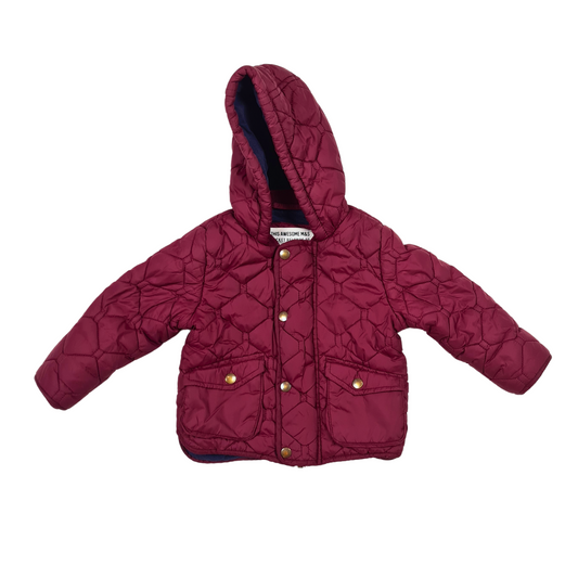 Quilted hooded jacket with zip and snap front fastening