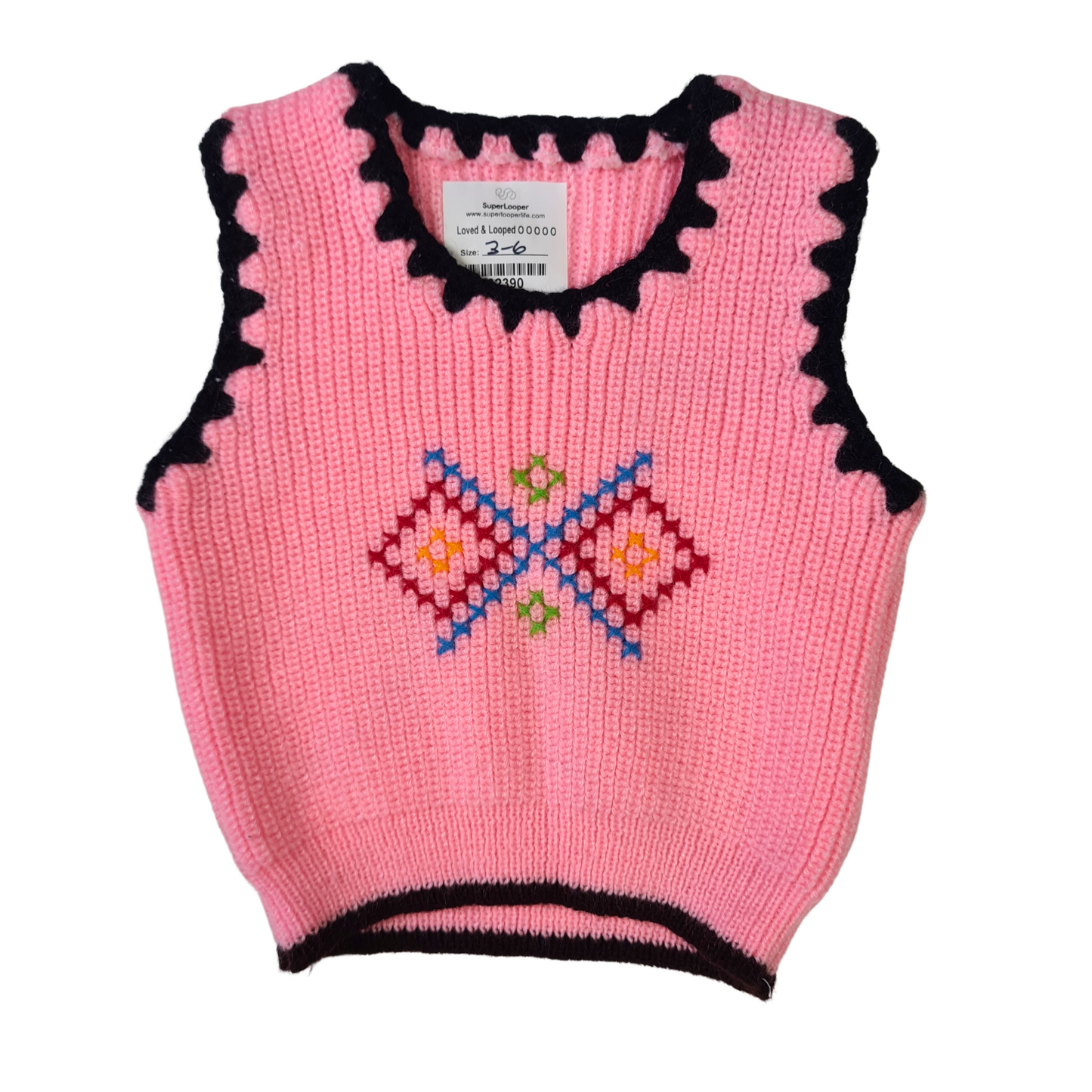 Knit Vest with embroidered design.
