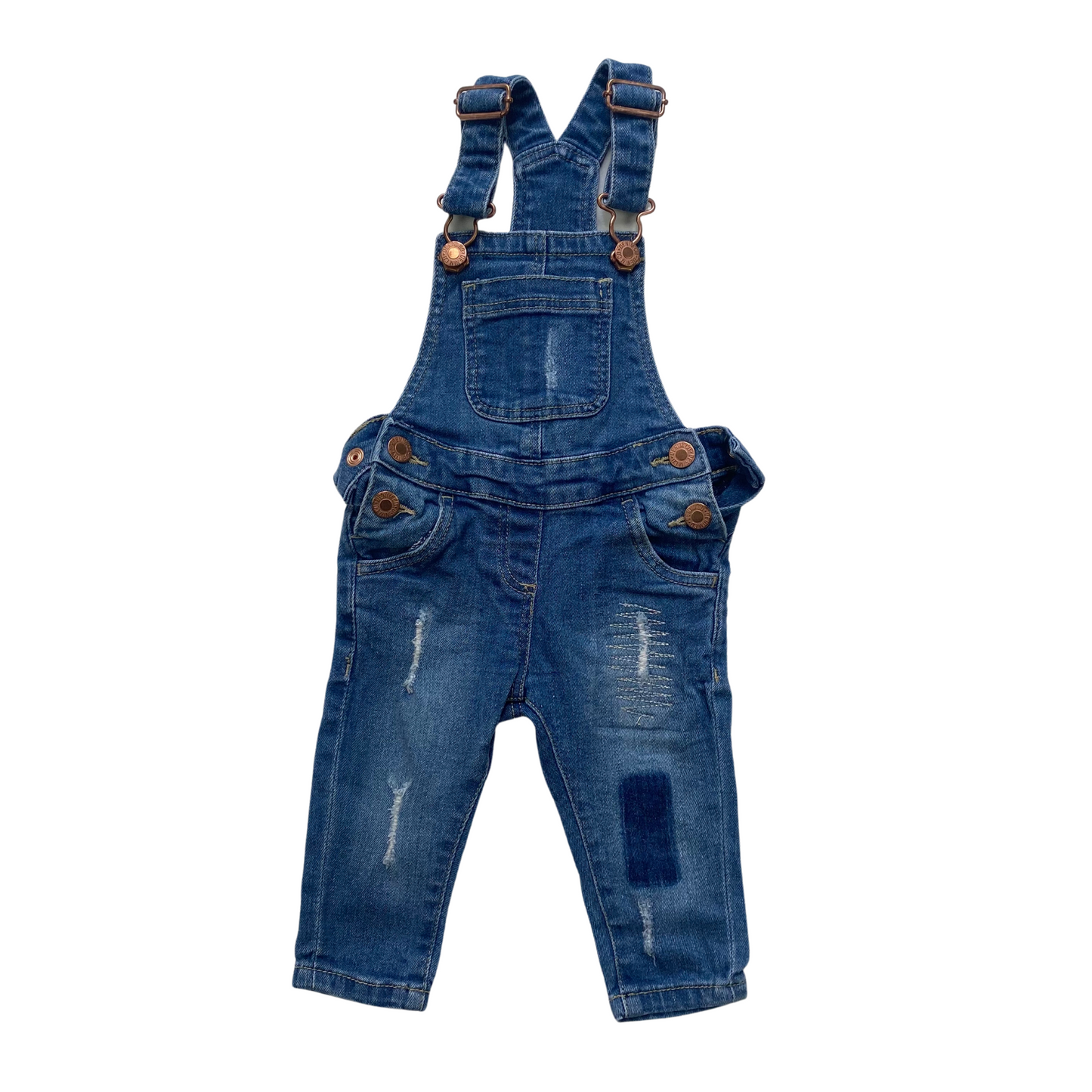 Distressed denim dungarees with skinny fit leg.