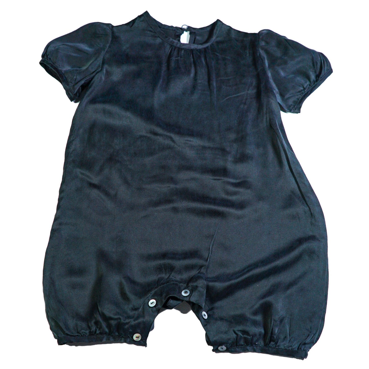 Silk romper with shell button back fastening and puff sleeves